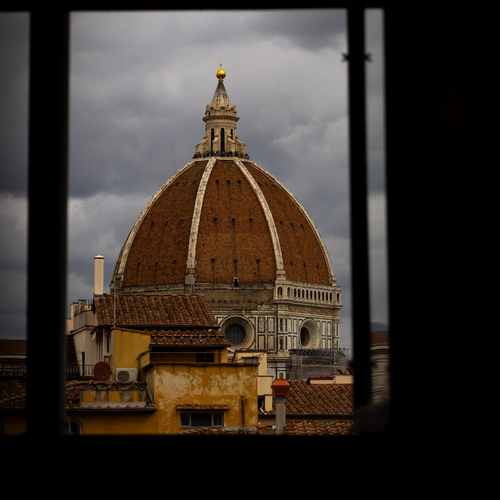 Florence Duomo dome framed by rooftop bars