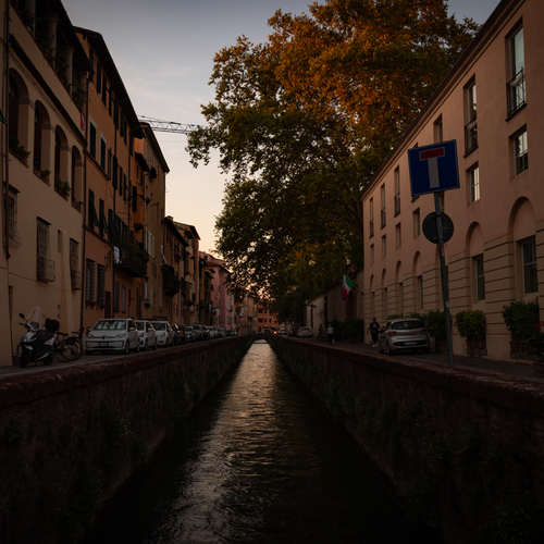 Florence street at dusk beside a canal