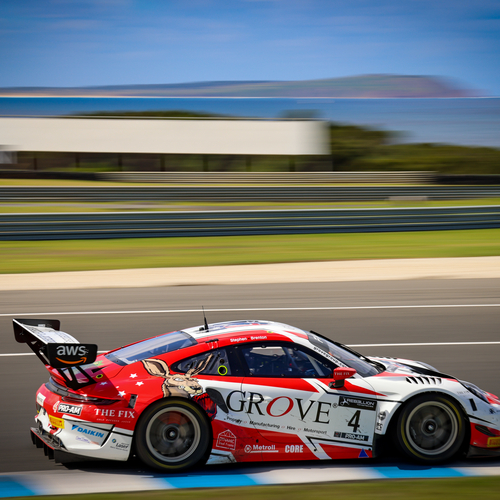 Race car in motion on a coastal circuit