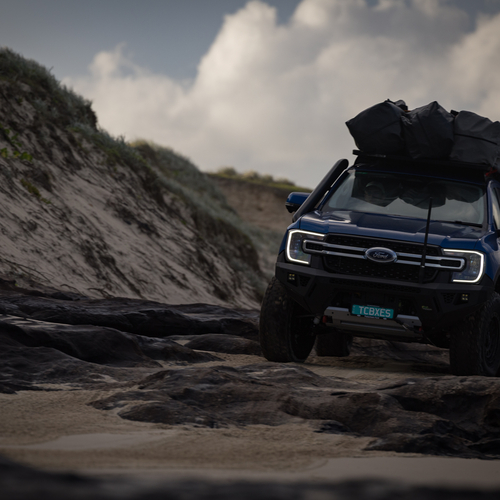 SUV parked on a coastal dune